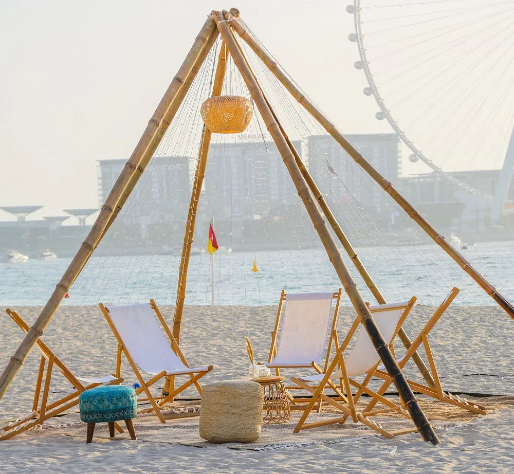 FABRIC & JUTE POUFS on a beach, versatile for seating or decor, embodying elegance and functionality, suitable for various event settings by Party Social.