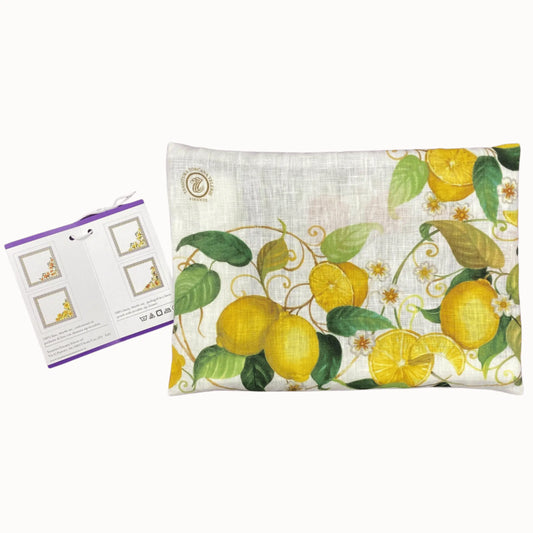 Pillow with lemon design and packaging on a white background
