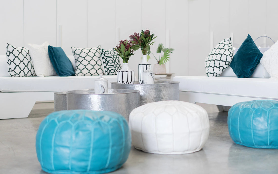 Moroccan Leather Poufs in a stylish room setting, showcasing their elegance and functionality as both seating and decorative elements.