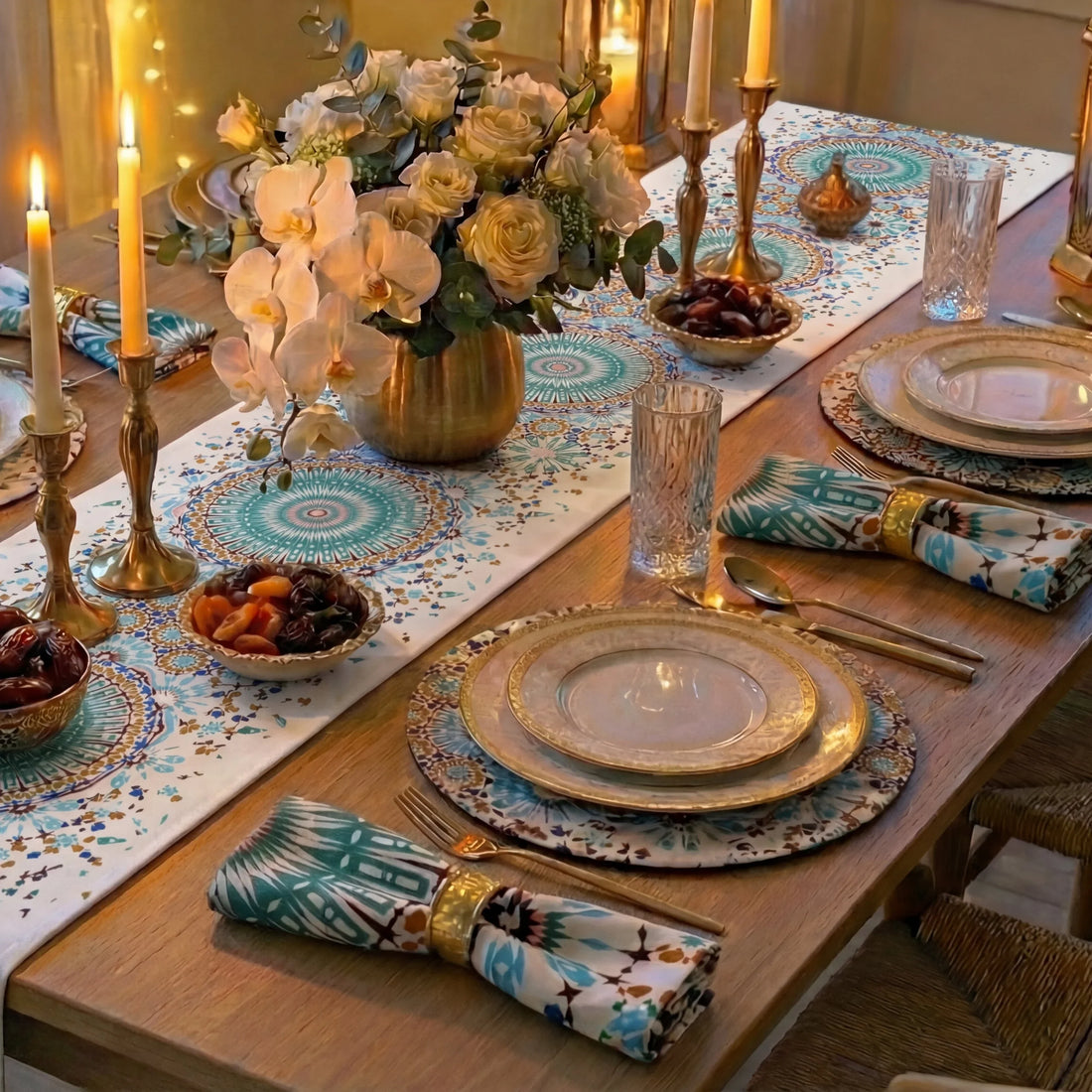 Dining table with Arabesque Polyester Linen Runner, teal and gold mandala pattern, gold accents, floral centerpiece, and elegant place settings, creating a luxurious, Middle Eastern-inspired tablescape.
