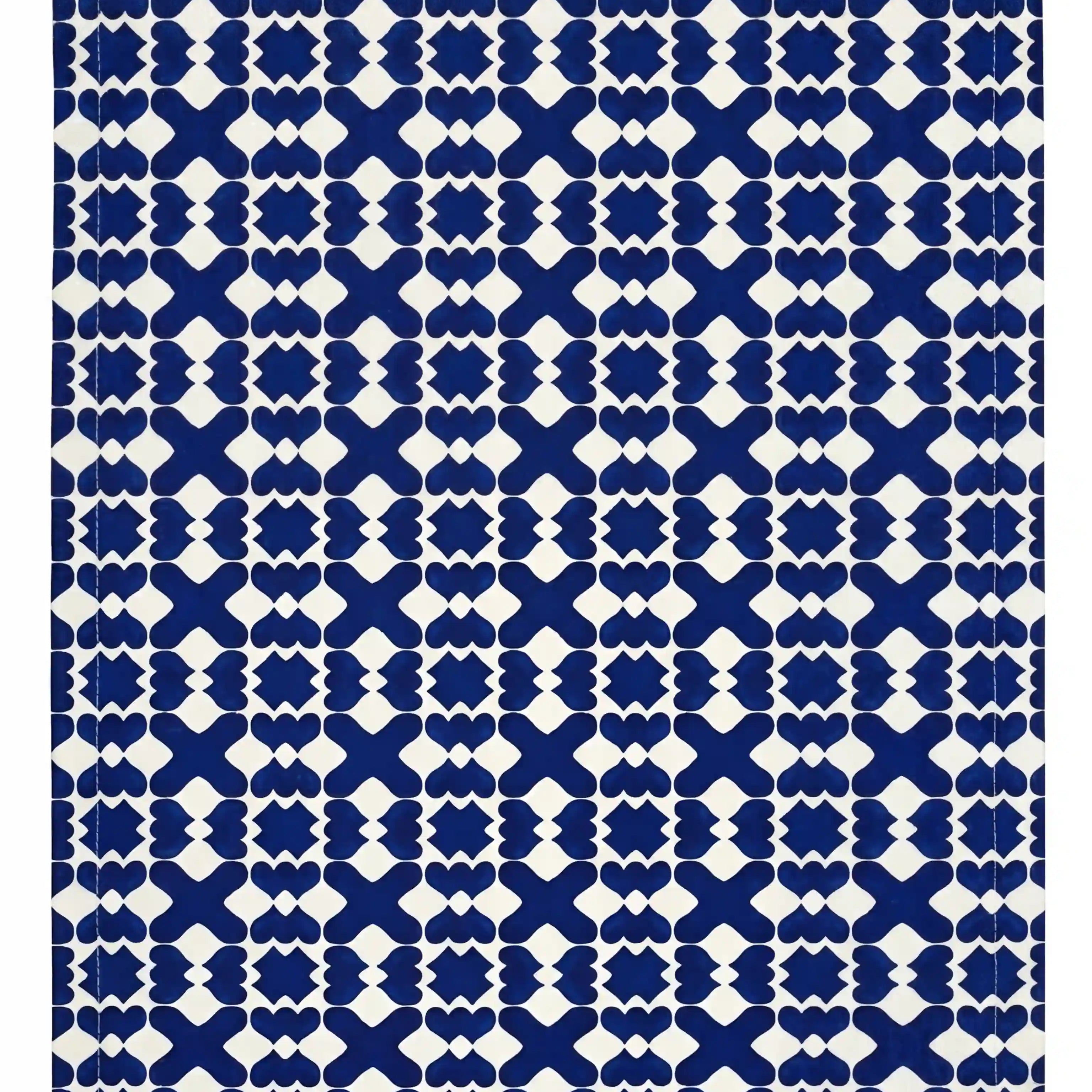 Marrakesh Linen Tablecloth, featuring a cobalt-blue geometric motif on a white base, ideal for elevating Mediterranean and contemporary table settings at events.