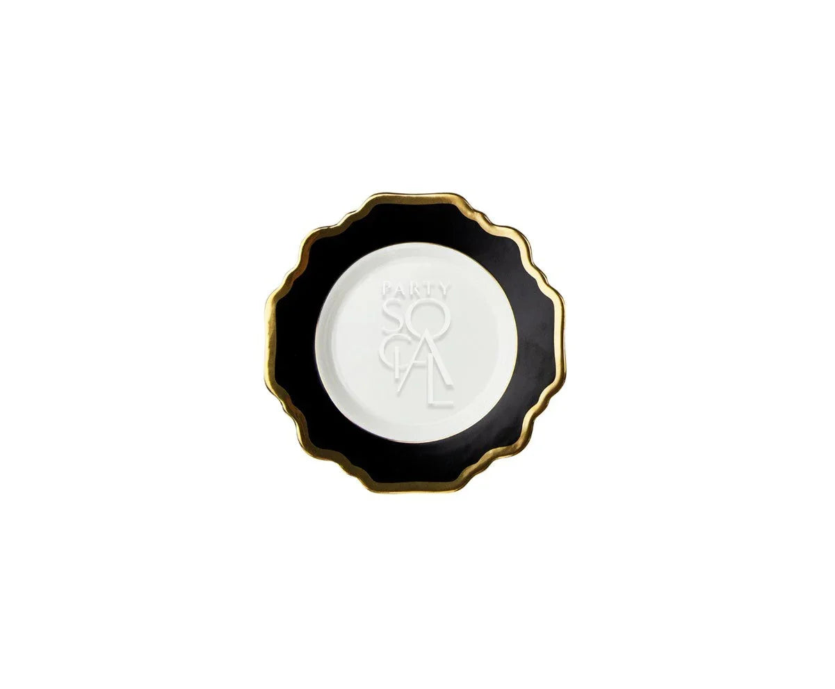 Black Lotus Collection decorative plate with a scalloped black rim, gold edge, and embossed PARTY SOCIAL white center, ideal for stylish dining settings.