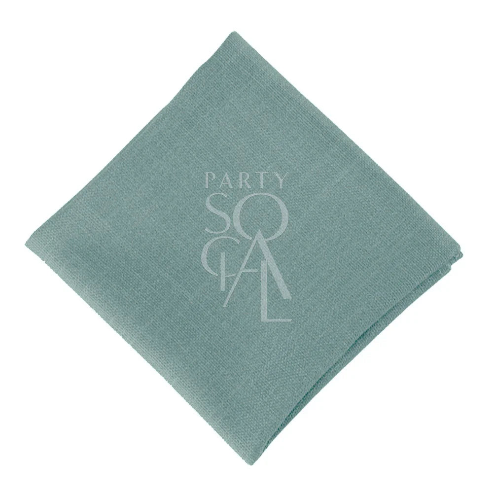 NAPKIN COTTON LINEN, folded square with a stitched logo, ideal for events. Premium cotton for versatile use at parties or corporate gatherings.