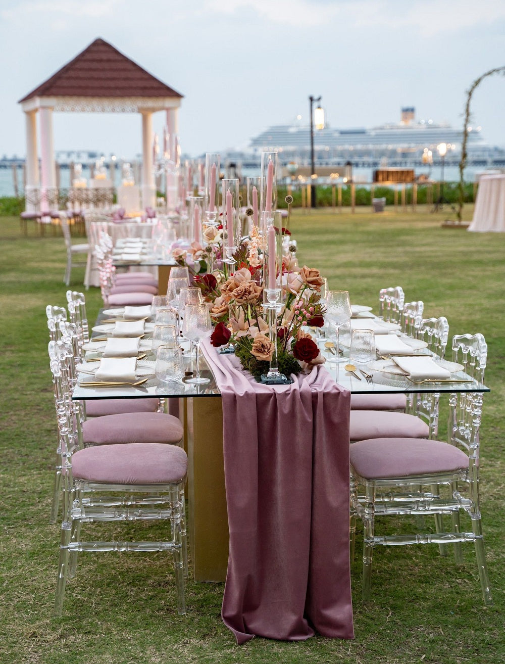 Napoleon Acrylic Chair set at a dinner party table, ideal for weddings and events, showcasing its elegant and versatile design.