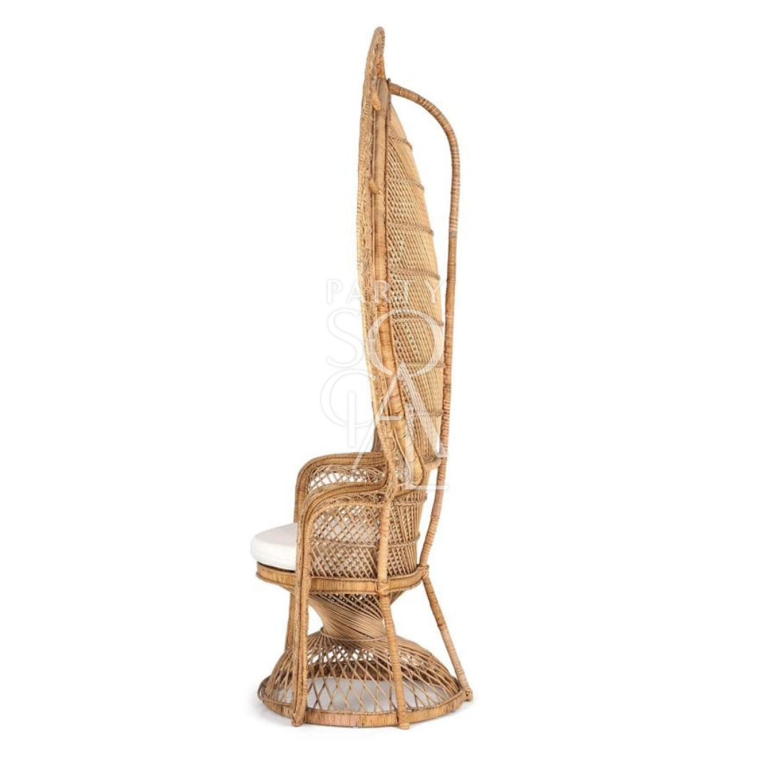 PEACOCK CHAIR: Cane wicker chair with a white cushion, ideal for weddings and outdoor events, offering a vintage aesthetic.