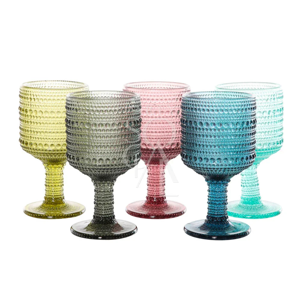 Set of five translucent Vintage Pearl Glass Goblets with hobnail texture, ideal for elevating event tablescapes. Featured: Navy Blue Vintage Pearl Tumbler from Party Social.