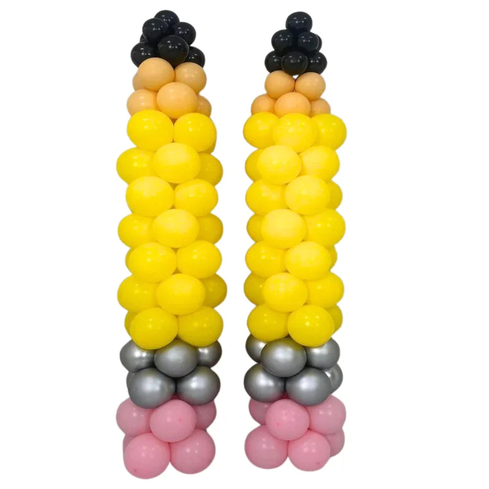 Pencil Balloon Pillars set of 2, featuring yellow and black balloons stacked to form pencil shapes, ideal for Back To School events.