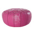 Moroccan Leather Poufs: Elegant pink leather ottoman, versatile for seating or as a decorative element, ideal for enhancing party or event decor.