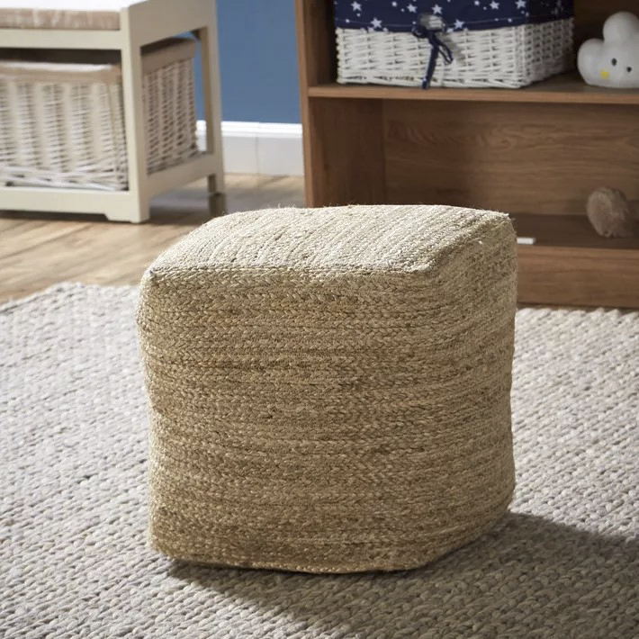 FABRIC & JUTE POUFS on a rug, showcasing a woven square design, ideal as a decorative, functional element for events or home use.