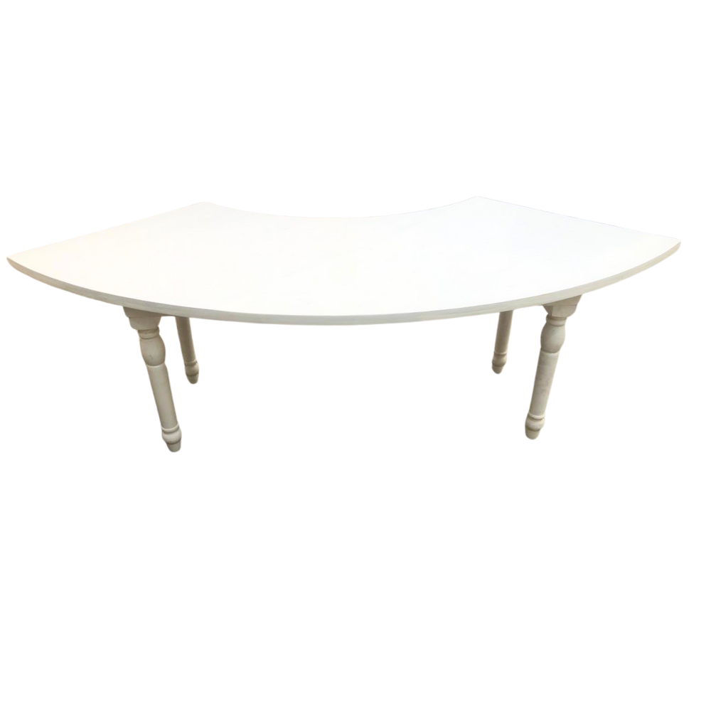 White Crescent Dining Table with a semi-circular wooden design and turned legs, ideal for elegant dining setups and event spaces.