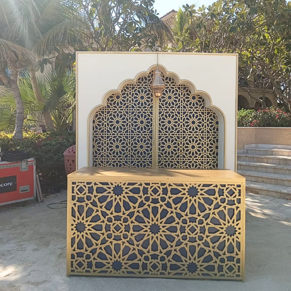 Arabesque Gold Bar Unit with elegant gold finish, ideal for upscale events, weddings, and corporate gatherings, featured prominently against a patterned background.