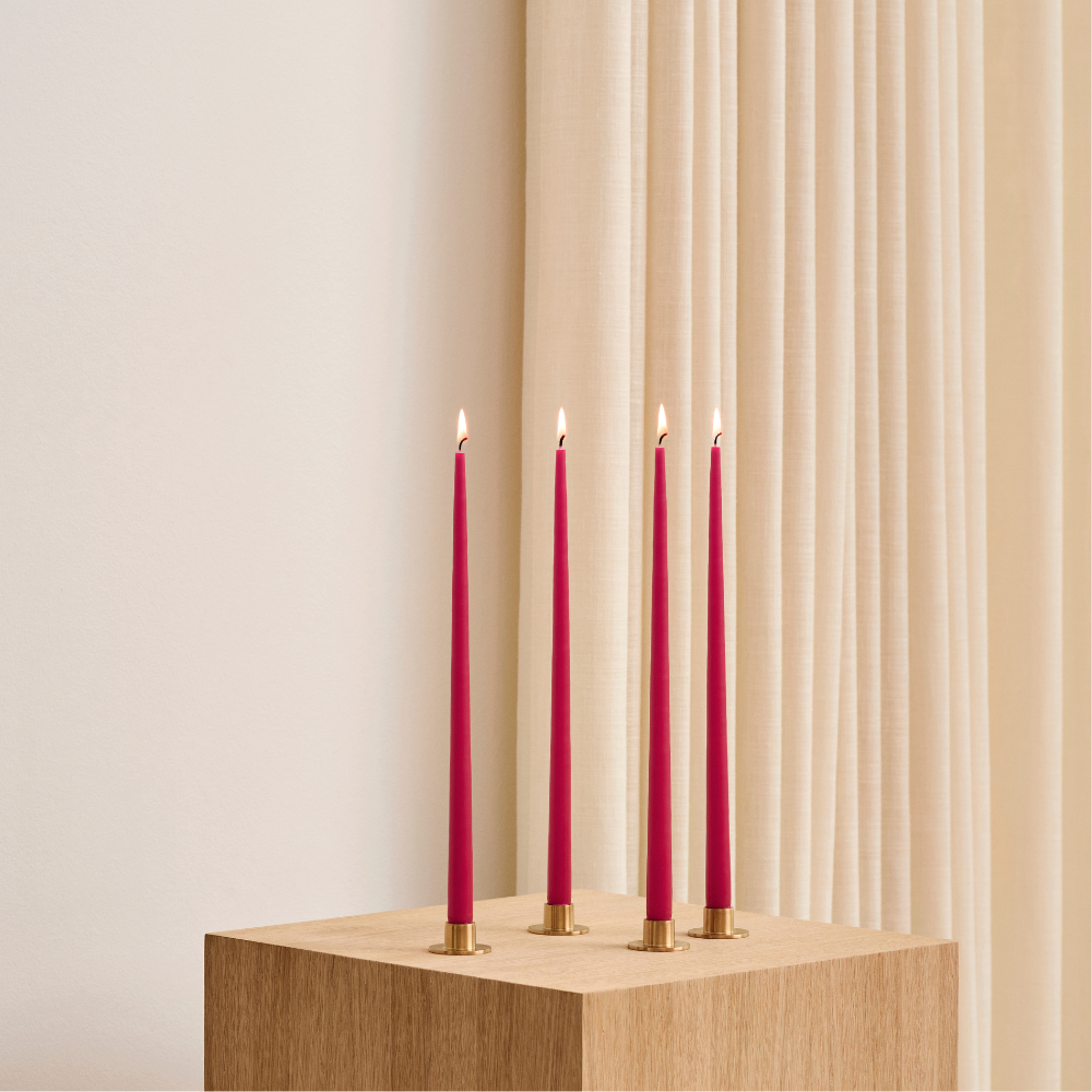 Slim Tapered Smokeless and Dripless Candles, 32cm, elegantly arranged on a wooden block, ideal for enhancing event ambience with their artisan Danish craftsmanship.