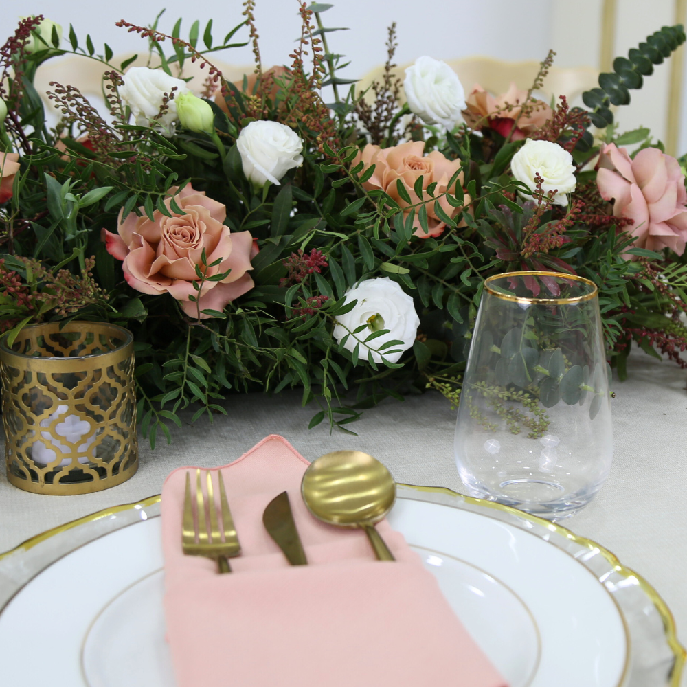 Golden Edge Glasses on a table with elegant tableware and floral centerpiece, perfect for enhancing any special event or celebration.