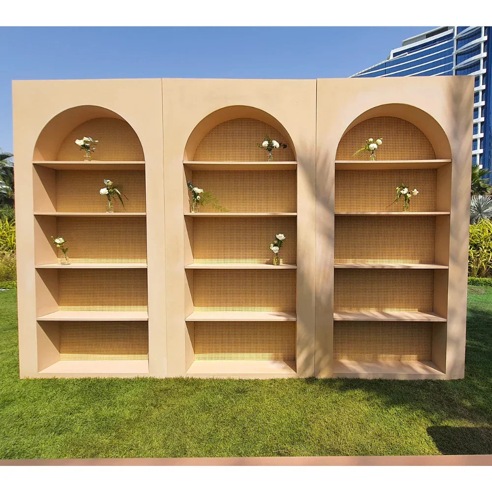 Wooden Rattan Bar Back with wooden frame and rattan panels, ideal for displaying glassware or décor at events, enhancing both indoor and outdoor party settings.