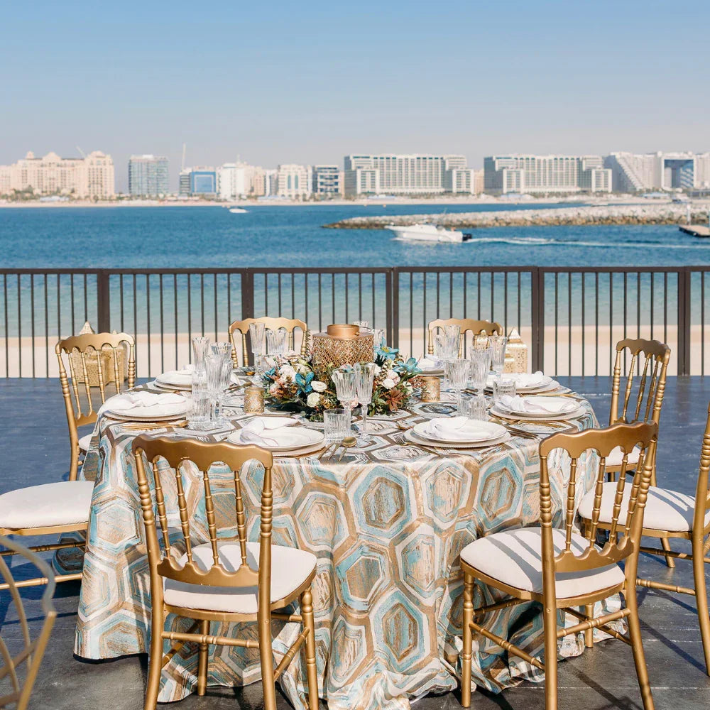 Blue & Gold Geometric Pattern Round Tablecloth, perfect for adding luxury to event décor, available at Party Social for weddings and special occasions.