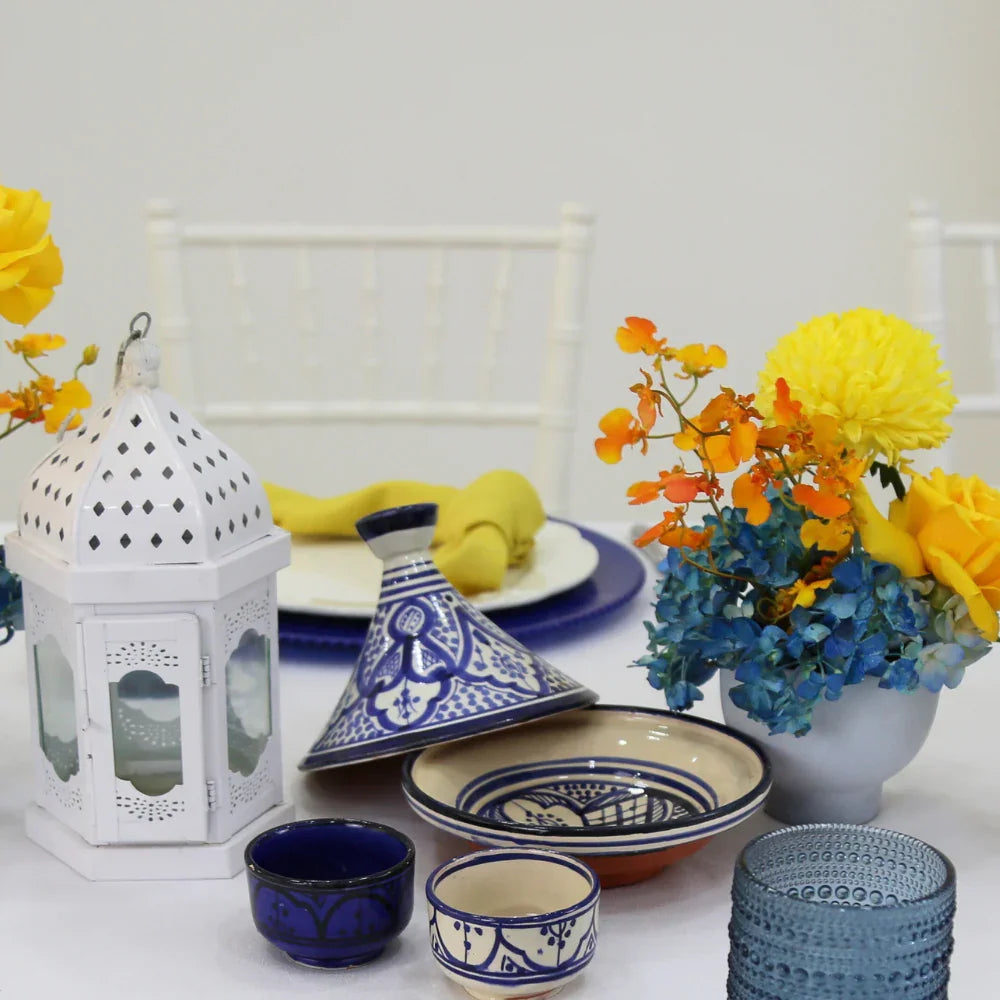 Marrakesh Tagine elegantly displayed with blue and white ceramic dishes, ideal for enhancing table settings at parties and events.