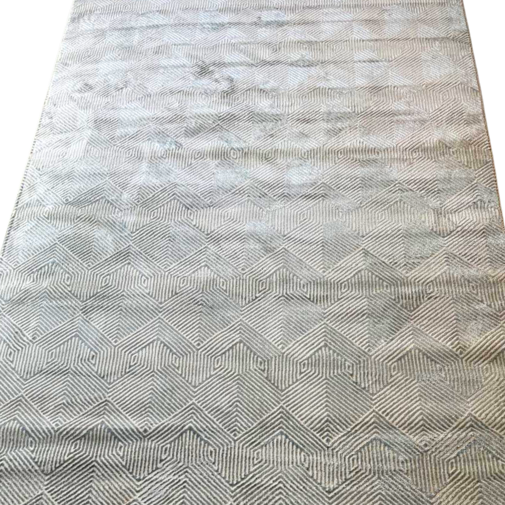 RUG MID-CENTURY MODERN: A light-neutral area rug with a geometric pattern, offering retro-inspired charm and modern functionality, ideal for enhancing rental spaces.