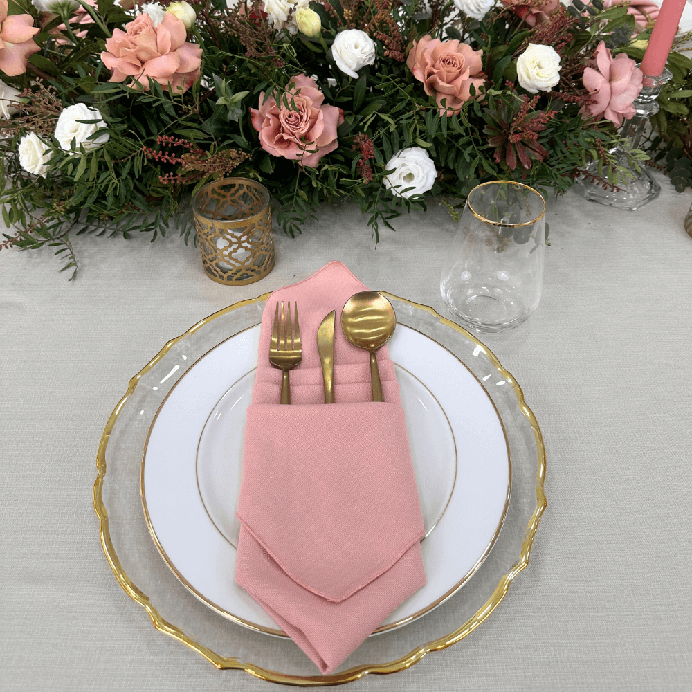 Ramadan Luxe- Dining Setup: Elegant table setting for eight with gold cutlery, glassware, napkins, plates, candle holders, and a floral centerpiece. Ideal for events.