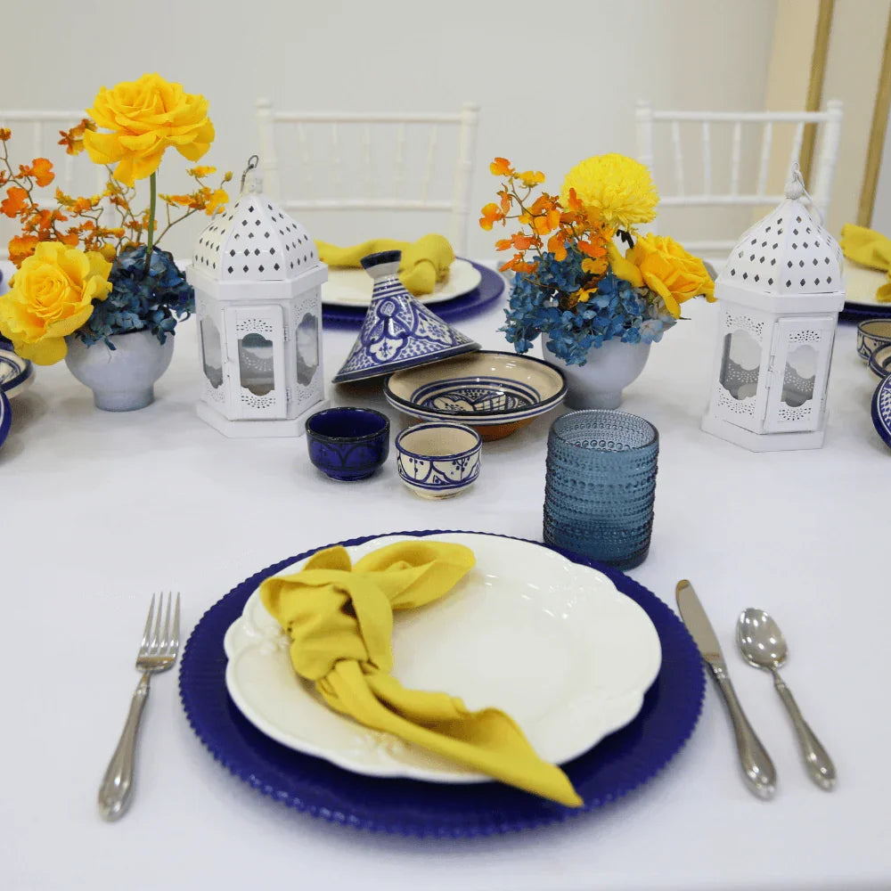 CHARGER PLATE - ULTRAMARINE LINED displayed on a table with elegant tableware, featuring a premium lined glass design, perfect for enhancing any event setting.