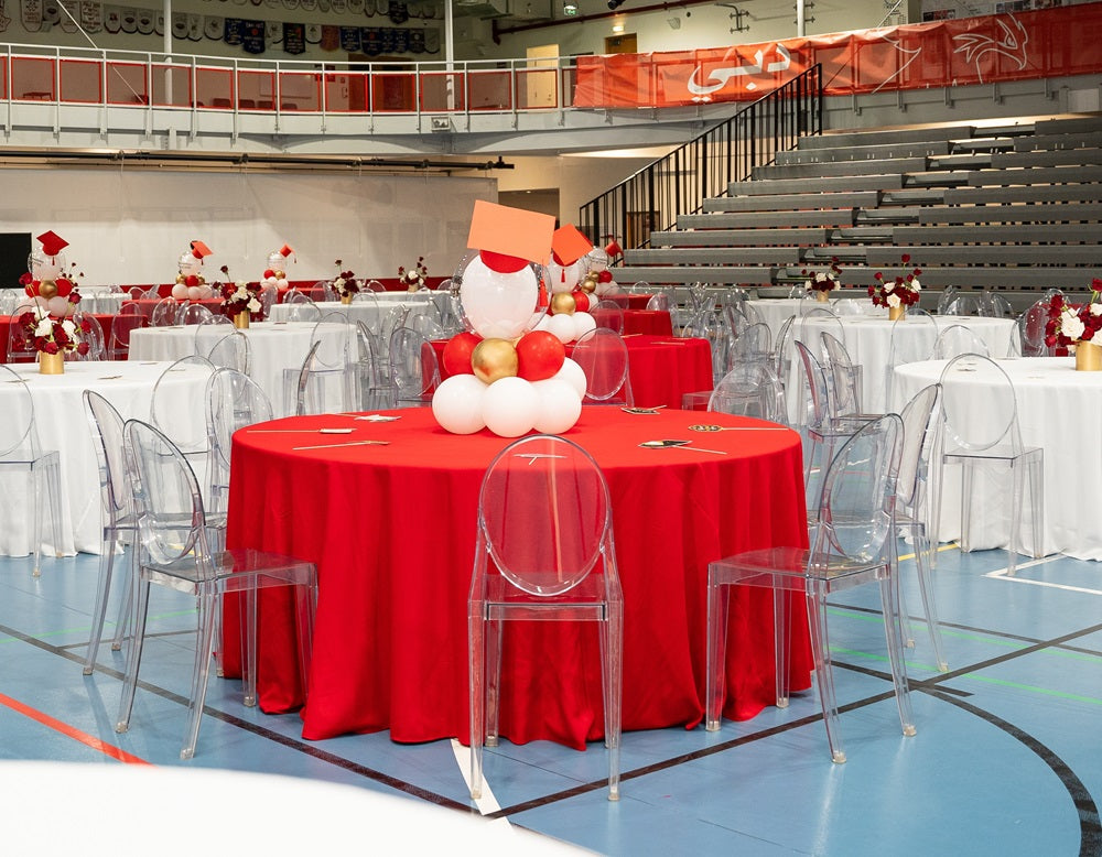 Ghost Chair W/O Arms (Victoria) displayed around a round table, highlighting its transparent design, suitable for events like weddings and corporate functions.