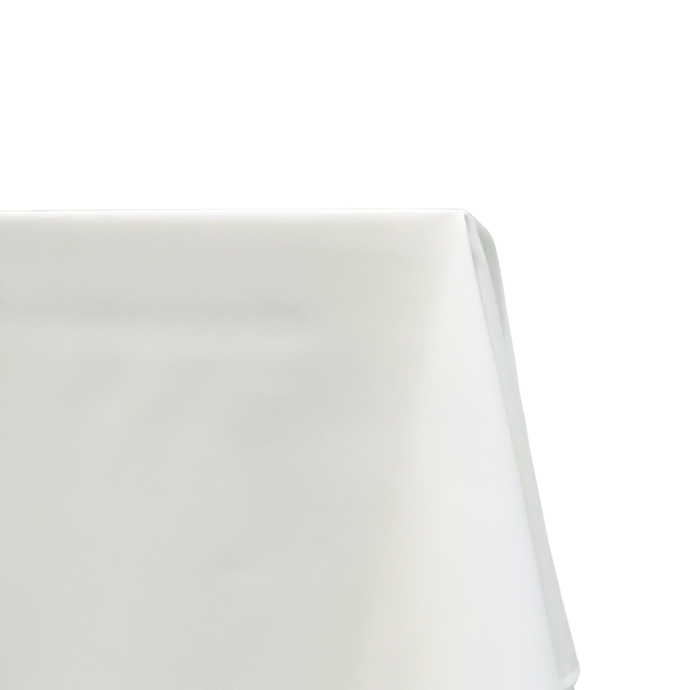 Polycotton Tablecloth drapes elegantly over a table corner, offering a reusable, cloth-like feel, ideal for party settings and special occasions.