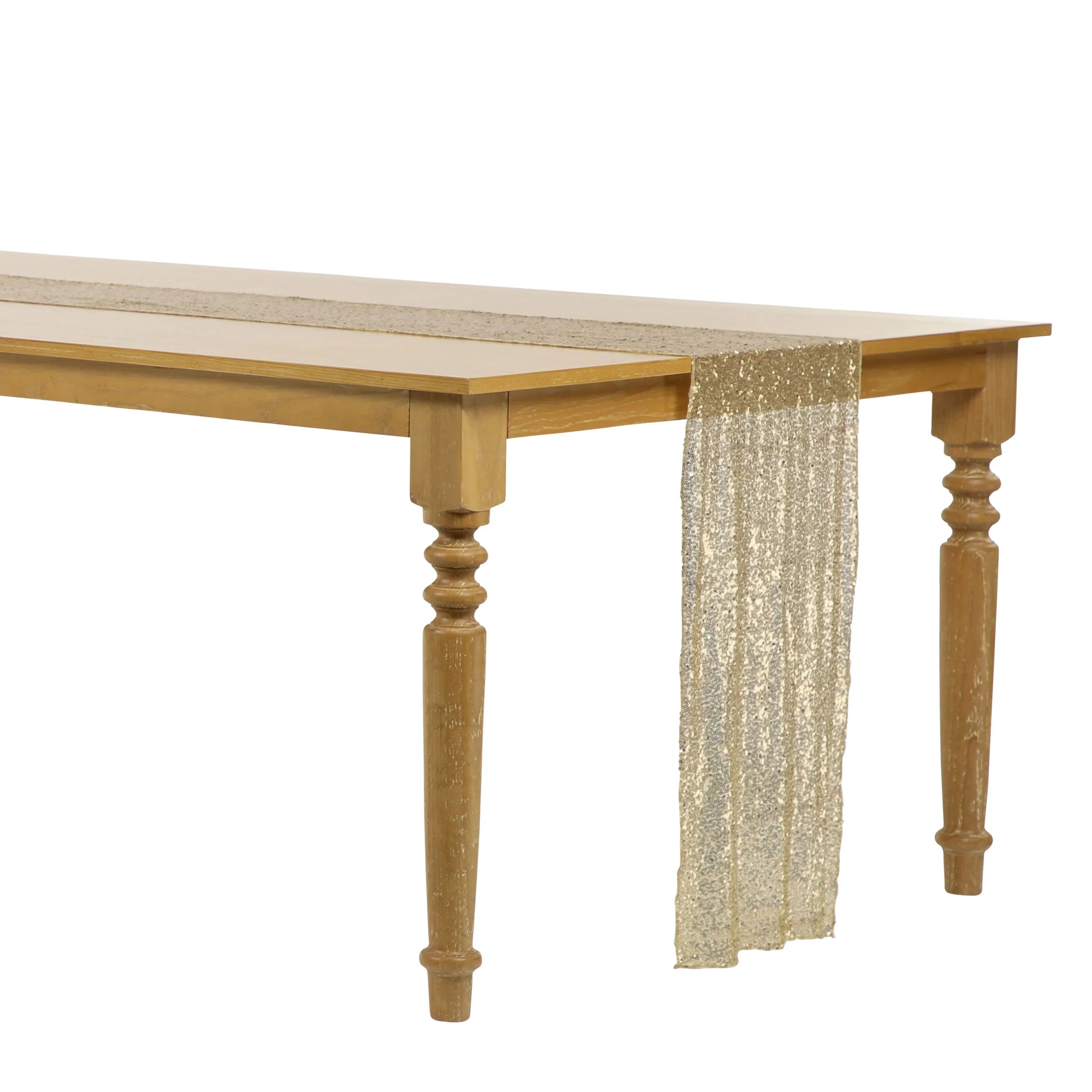 Sequin table runner on a gold-clothed table, enhancing elegance with its shimmering design, ideal for special occasions.