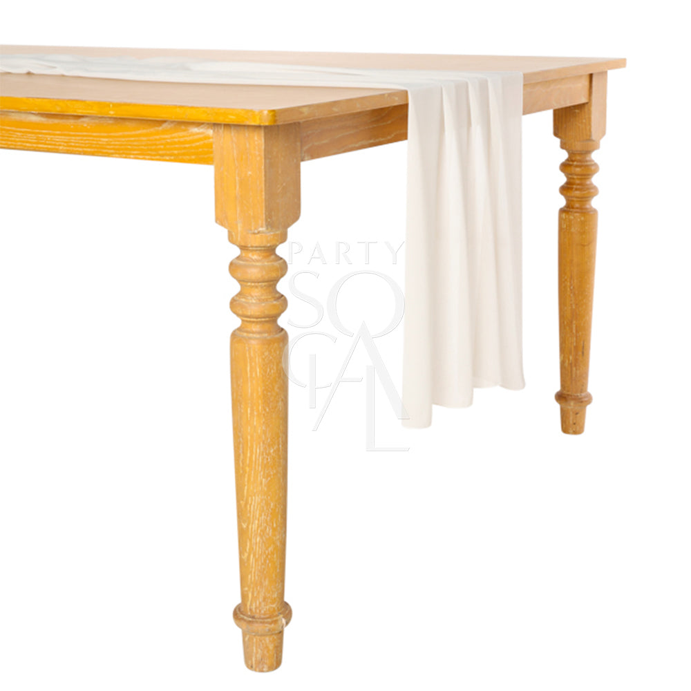 Chiffon Table Runner displayed on a table, highlighting its elegant drape, ideal for enhancing tabletops at special events.