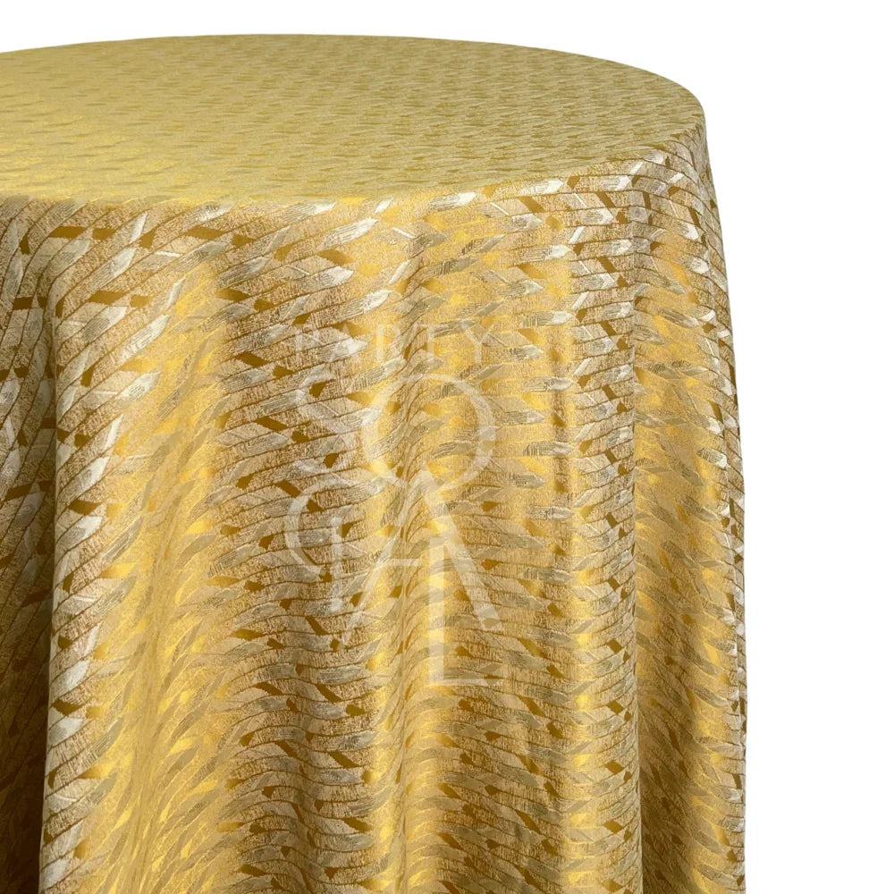 YELLOW TWIST CHEVRON TABLECLOTH drapes elegantly on a table, showcasing a subtle chevron weave, perfect for adding charm to brunches and celebrations.