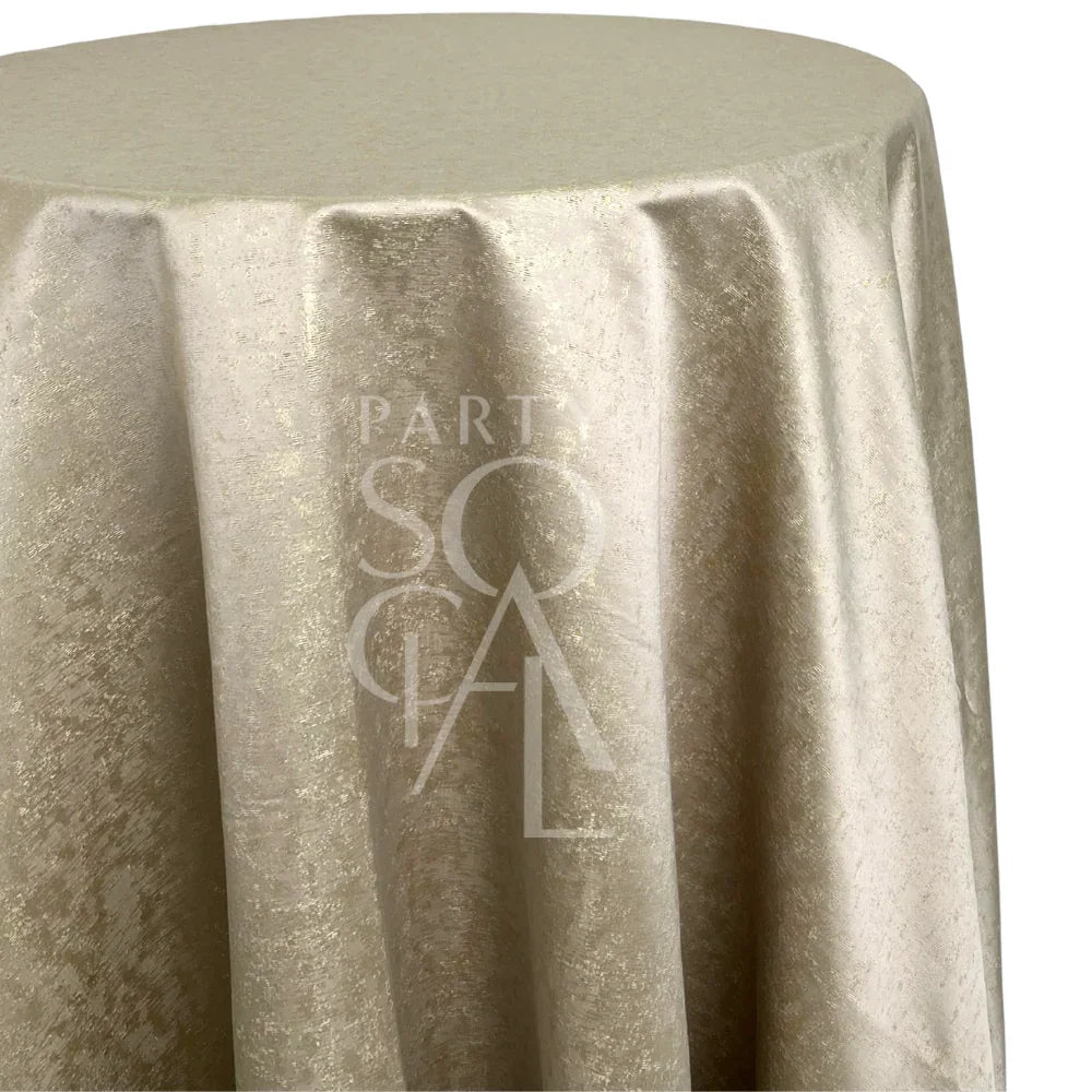 Champagne Sheen Tablecloth covering a round pedestal table, showcasing a shimmery, elegant drape with a faint PARTY SOCIAL watermark.