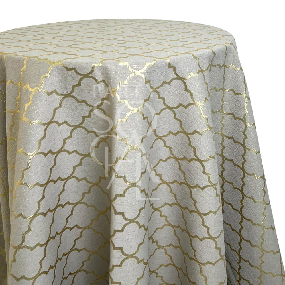 Golden Lattice Round Tablecloth with gold quatrefoil pattern on light-silver fabric, ideal for elegant events like weddings or bridal showers.