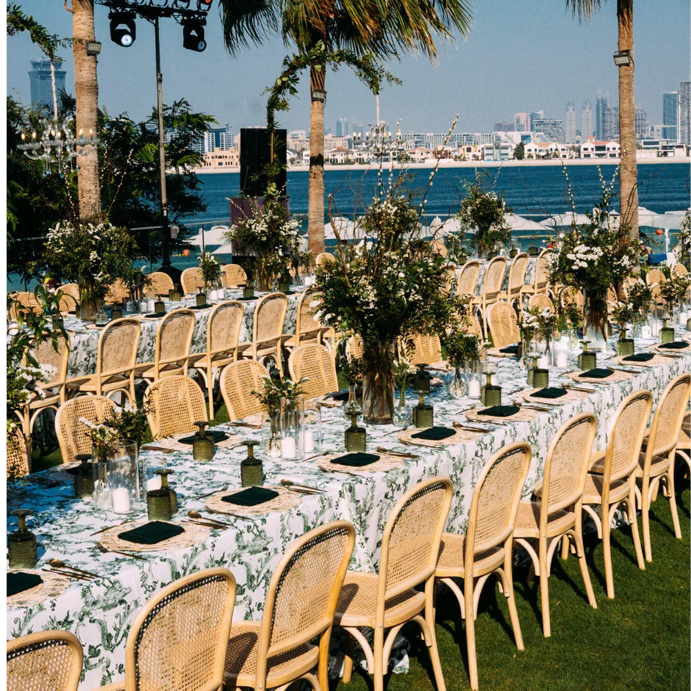 GREEN VINE RECTANGULAR TABLECLOTH elegantly drapes a long table, set outdoors for a party or wedding reception, enhancing the event&
