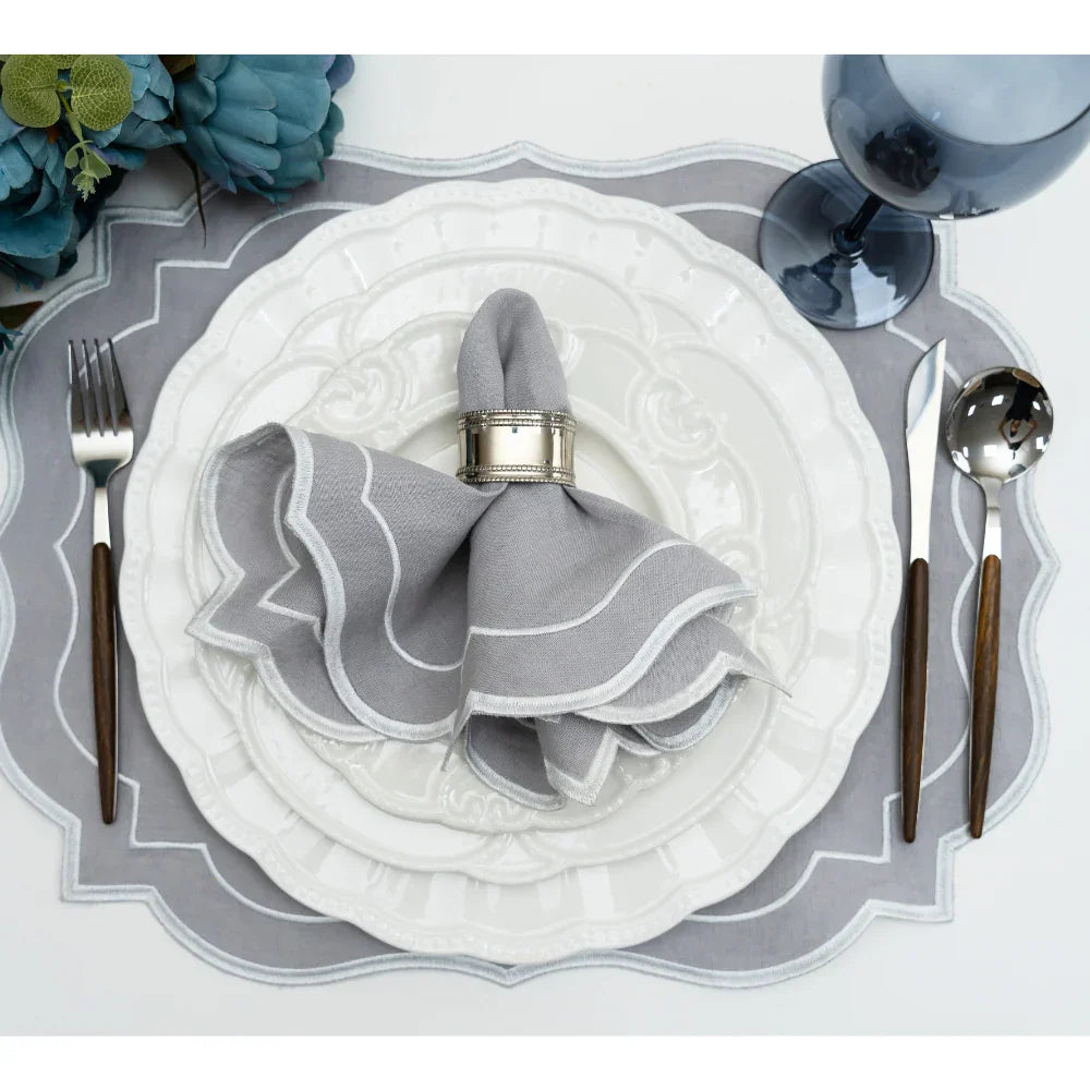 CUTLERY WOODEN SILVER displayed on a plate with napkin and silverware, ideal for enhancing table settings at events and dinner parties.