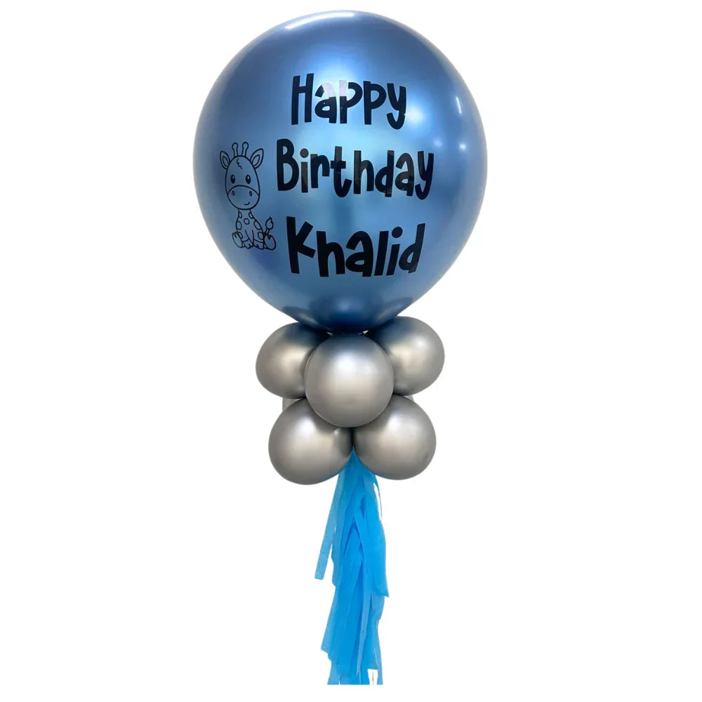 Personalized Birthday Balloon Wand with a large blue balloon featuring black text, surrounded by smaller silver and blue balloons, ideal for party photos.