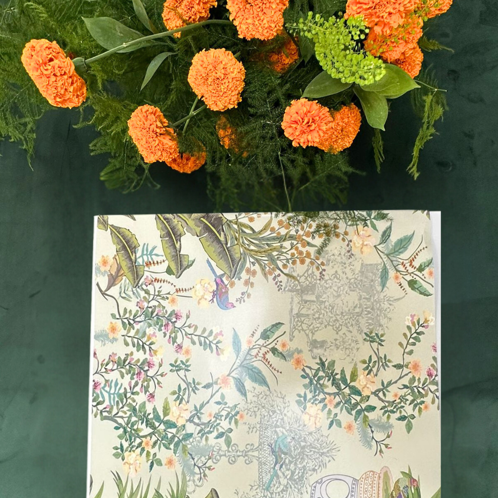 Diwali Thali Gift Box featuring a floral design, accompanied by two thali sets, ideal for gifting during special occasions.