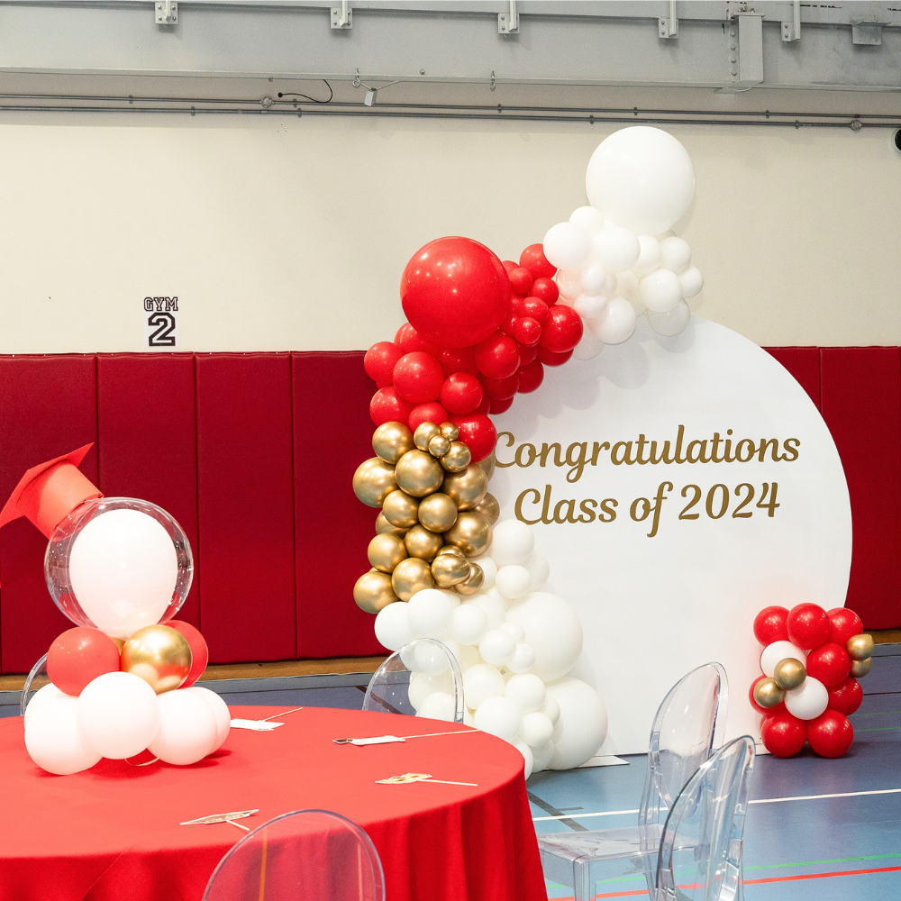 Round Wood Balloon Backdrop featuring a red and white balloon arch, perfect for enhancing any celebration with customizable, vibrant balloon arrangements. Ideal for party and event decoration.