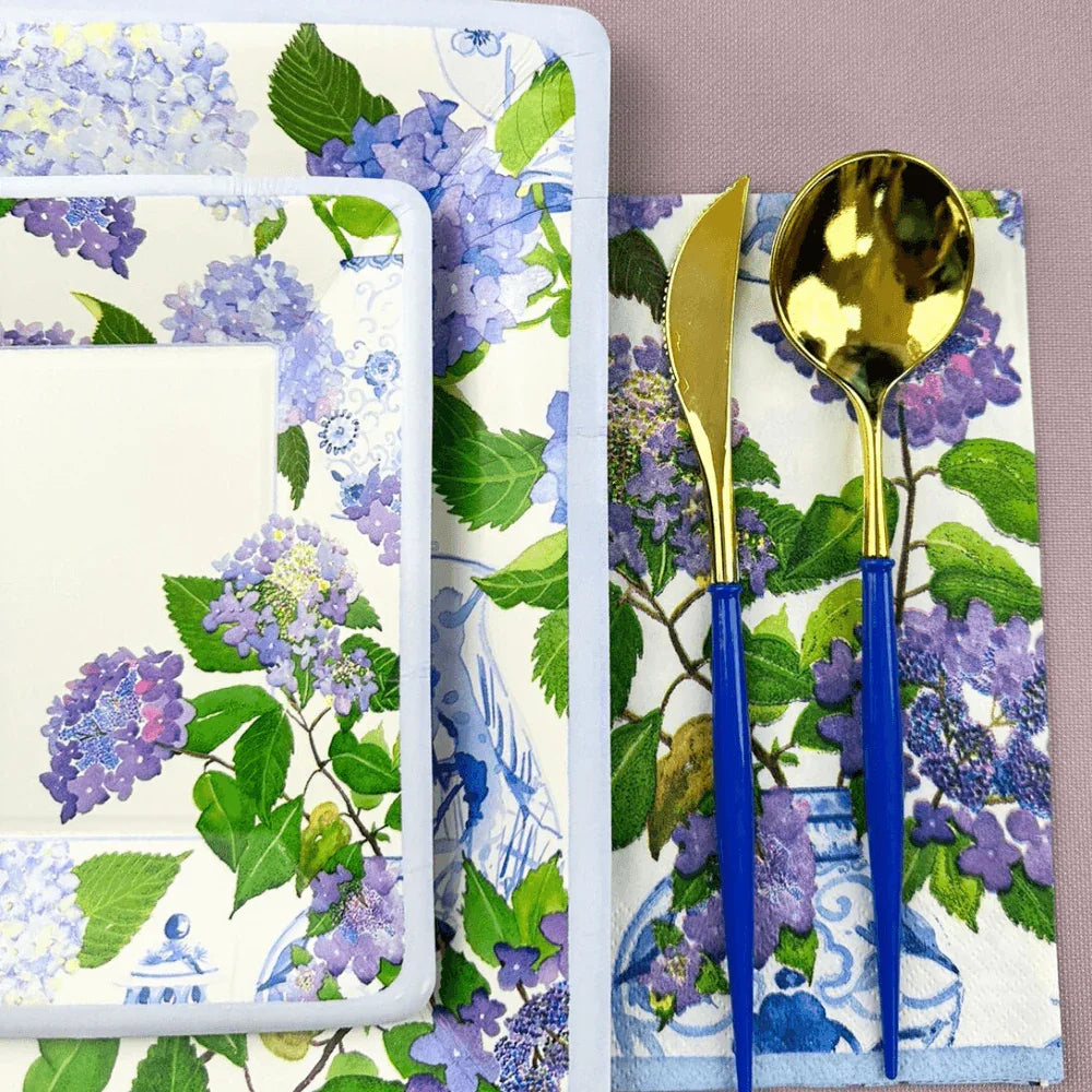 Hydrangeas and Porcelain Square Paper Salad & Dessert Plates - 8 Per Package, displayed with a spoon on a napkin, perfect for elegant yet effortless dining.