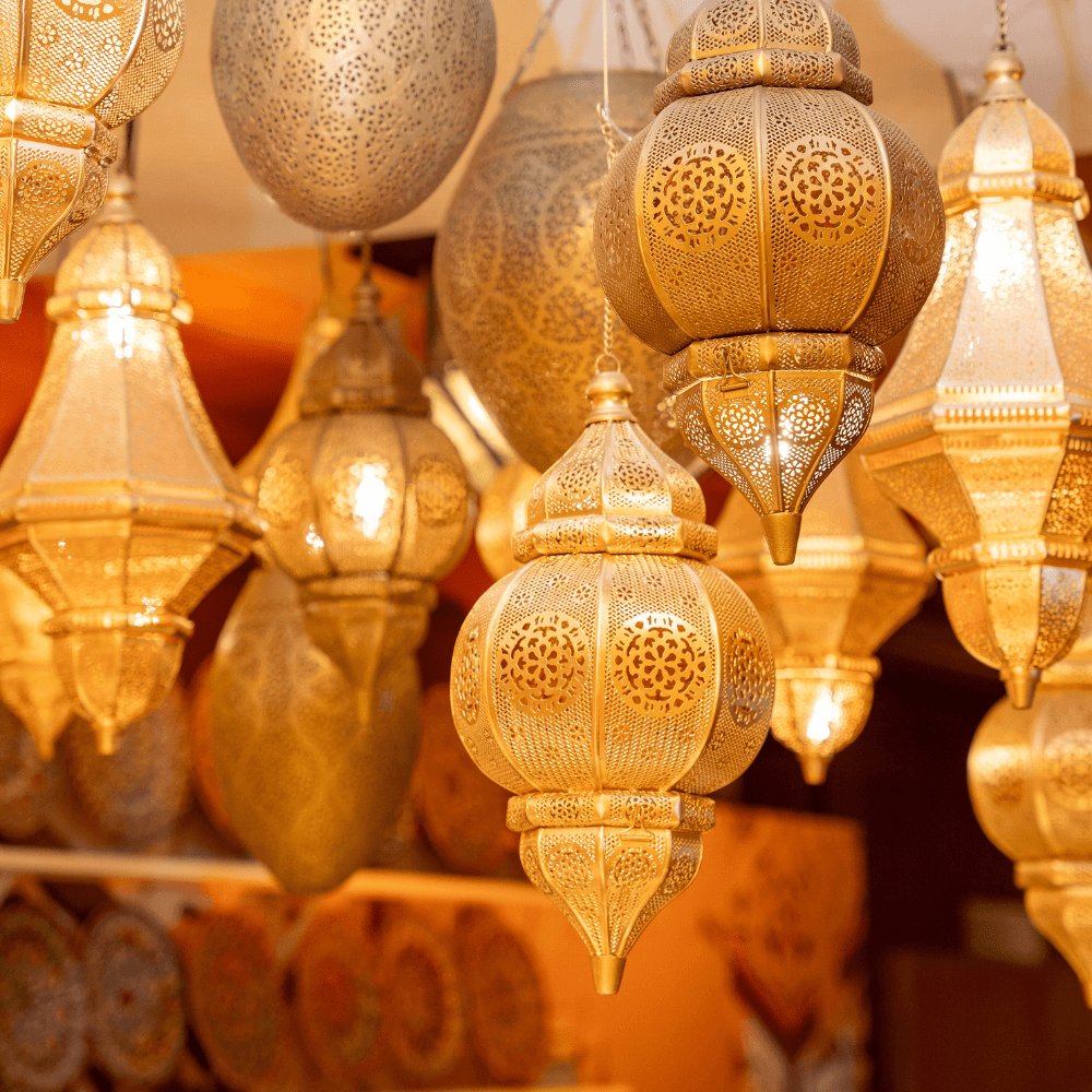 Round Moroccan Hanging Pendant with intricate designs, perfect for event decor, requires a candle for illumination. Ideal for creating a warm, inviting atmosphere at parties.