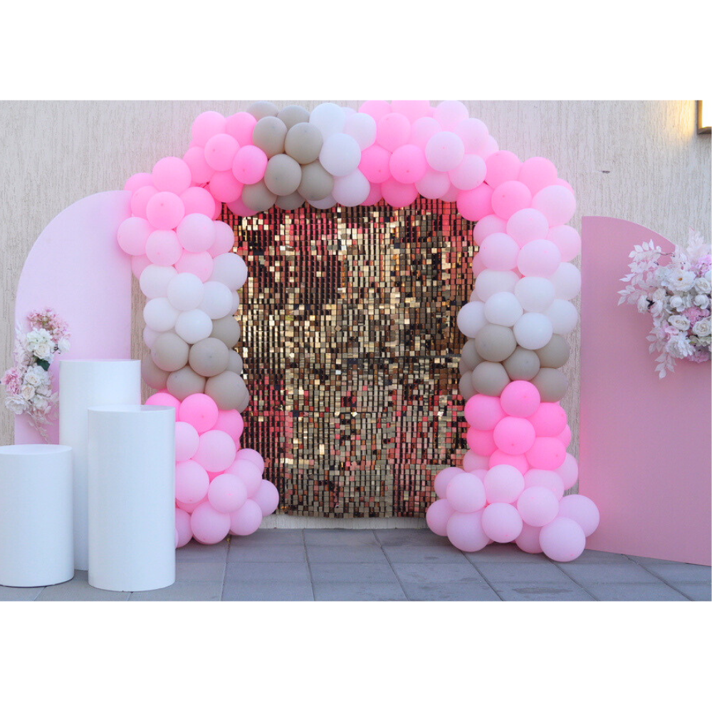Pink Chic Balloon Backdrop featuring a pink and white arch, ideal for parties and events, enhancing celebrations with a festive and elegant touch.