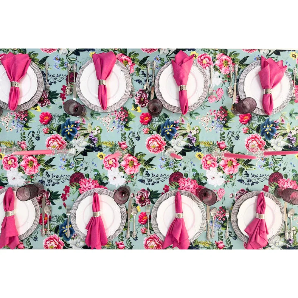PINK PEONIES RECTANGULAR TABLECLOTH displayed elegantly on a dining table, adorned with set plates and cutlery, enhancing any party or special occasion.