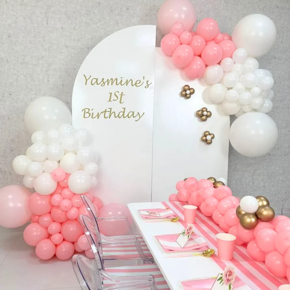 Semi Arches Balloon Backdrop featuring pink and gold balloons arranged elegantly on a table, ideal for enhancing party decor and creating memorable event settings.