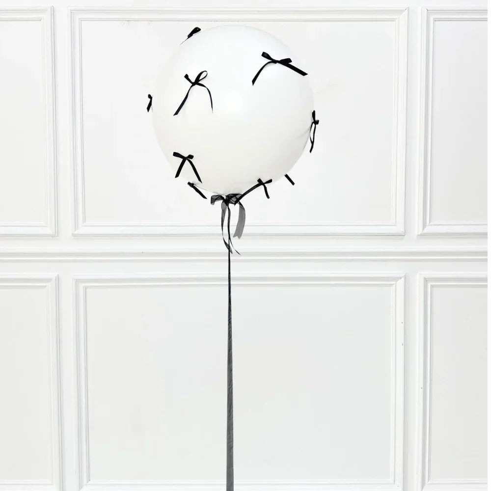 Bows Helium Giant Balloon with black bows and handmade ribbon tail, perfect for adding style to any celebration or party.