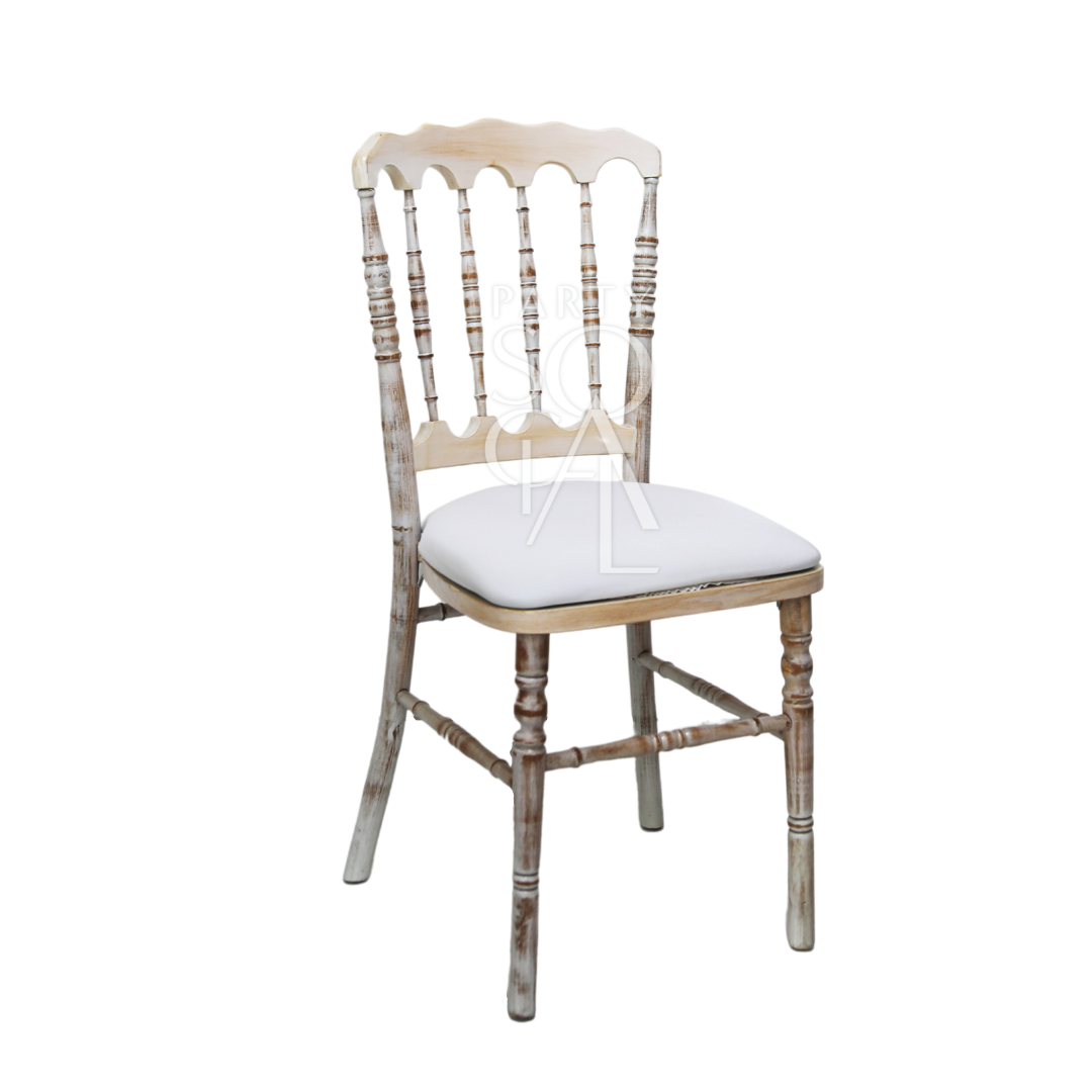 NAPOLEON CREAMWASH CHAIR with white cushion, featuring an armless, rustic design ideal for weddings and corporate events.