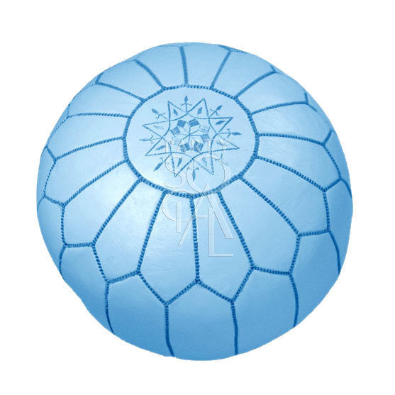 Moroccan leather pouf, circular design, versatile as a seat or decor, shown on a flat surface.