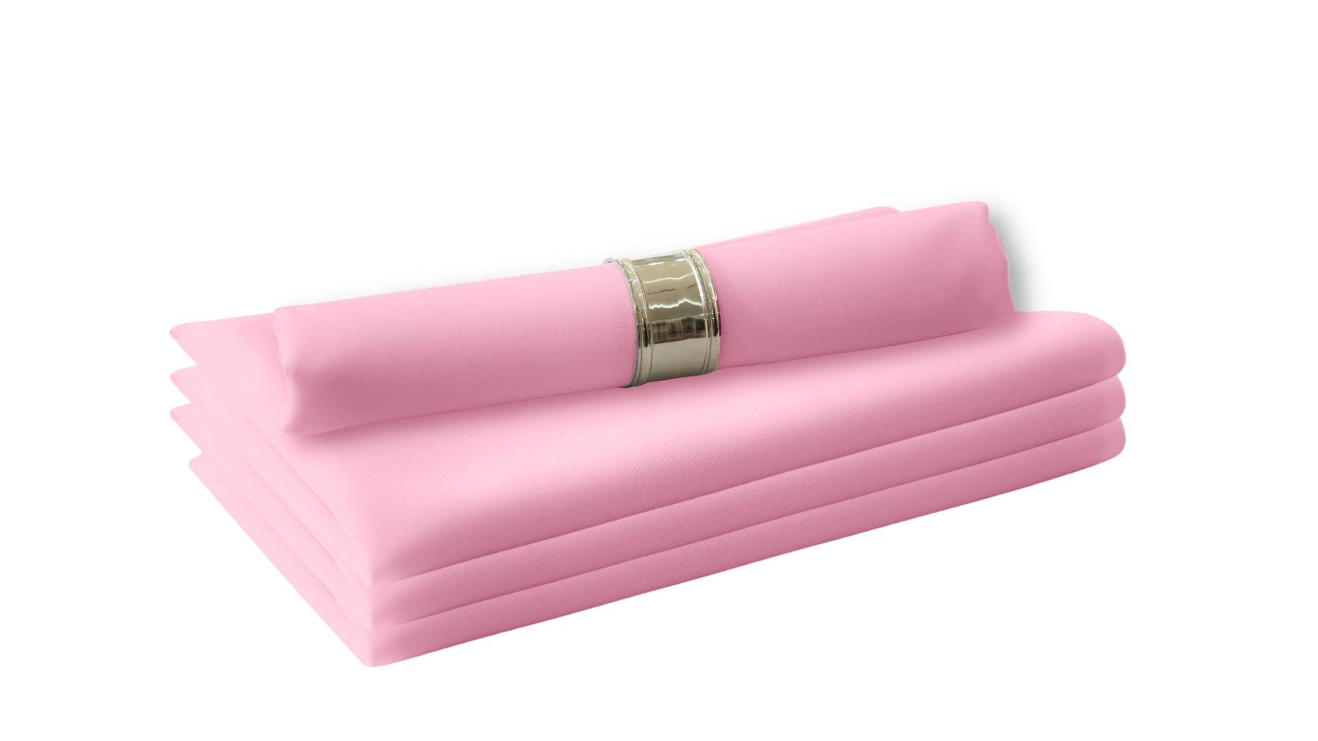 A stack of folded pink napkins, perfect for livening up your dinner table. Made of polyester fabric, these cloth dinner napkins provide a luxurious feel without the need for paper or plastic. Easy to wash and reuse, they are a staple in your dining table linens. 4 per pack.