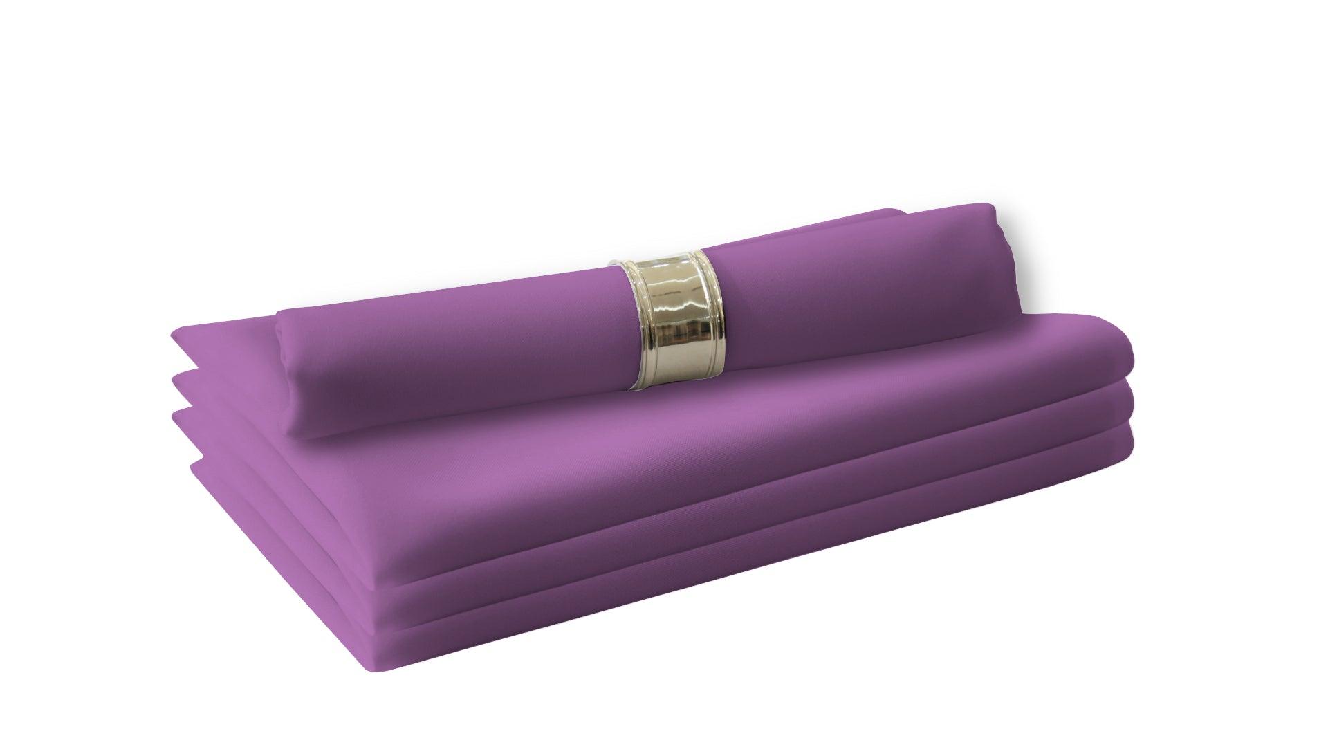 A stack of purple napkins, perfect for livening up your dinner table. Made of polyester fabric, these cloth dinner napkins are reusable and easy to wash. 4 per pack.