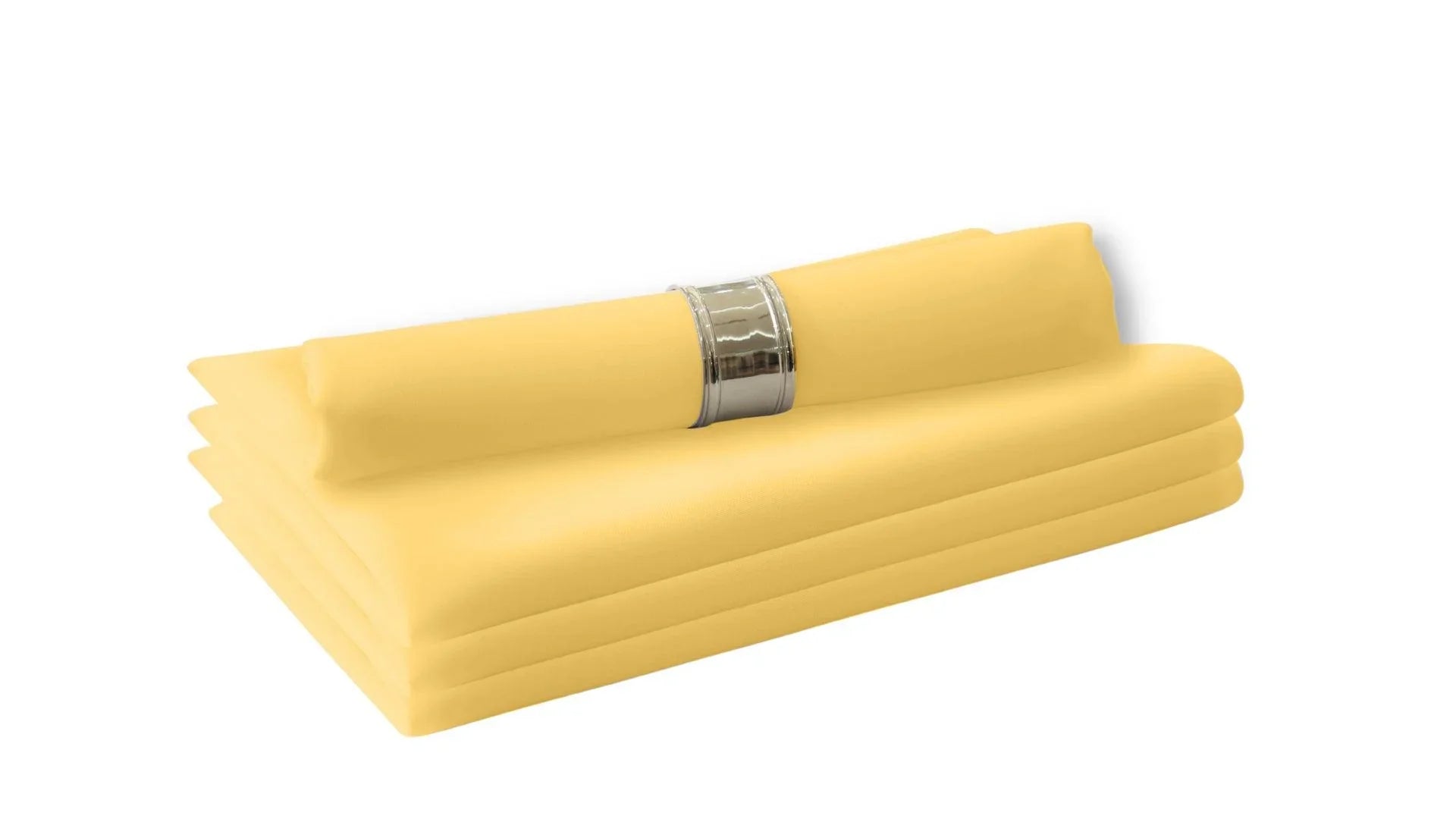 A stack of yellow cloth dinner napkins, part of the Polycotton Napkins- 4 per pack collection from Party Social. Perfect for livening up your dinner table with a cloth feel. Easy to wash and reuse, making them a staple in your dining table linens.