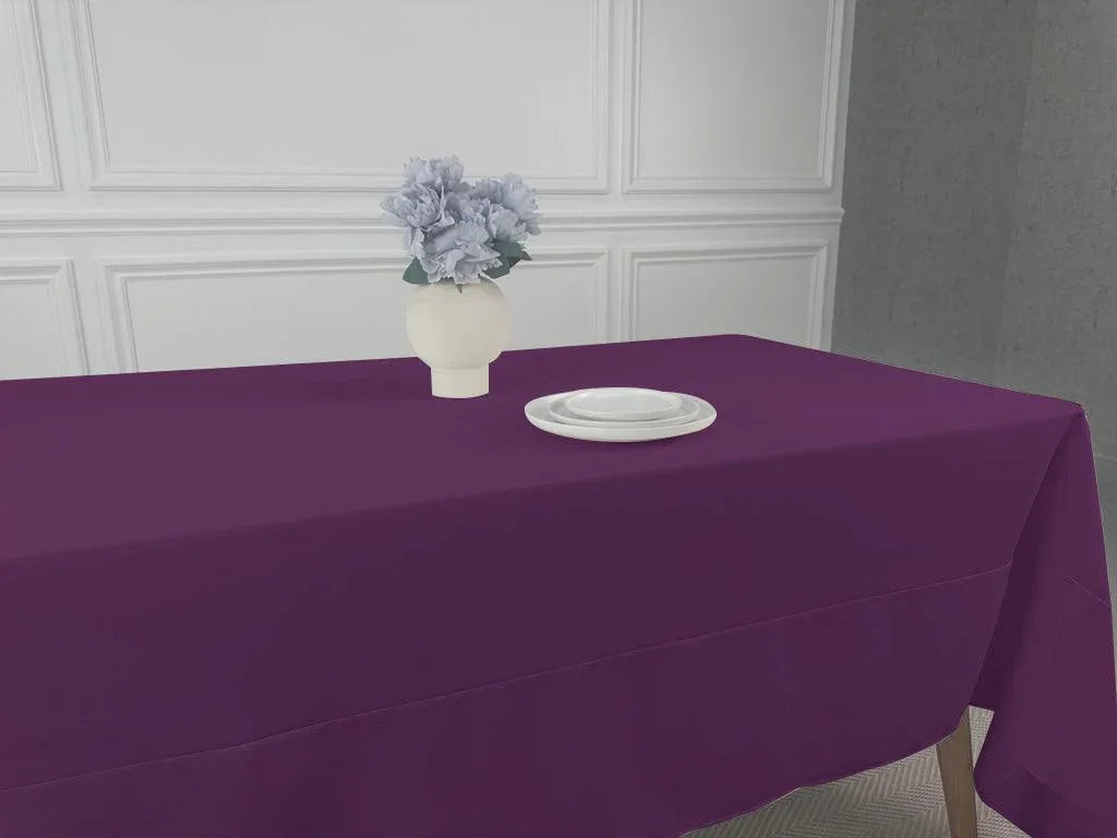 A simple tablecloth with a plate and vase of flowers. Perfect for any event or occasion. Easy to wash and reuse. Available in multiple sizes.