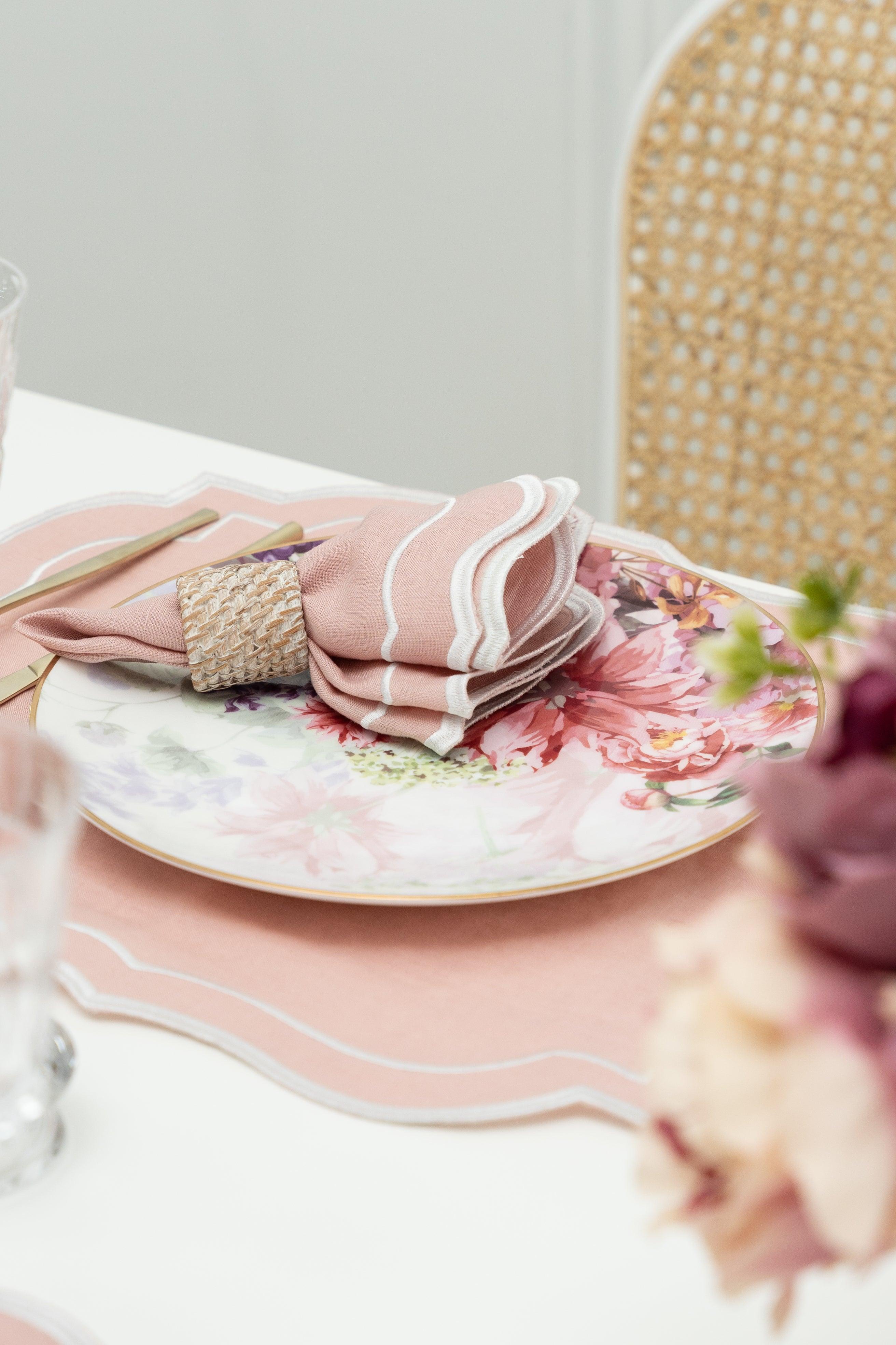 Scalloped Linen Napkins - 4 per pack, elegantly set on a table with a plate, fork, and wicker basket.