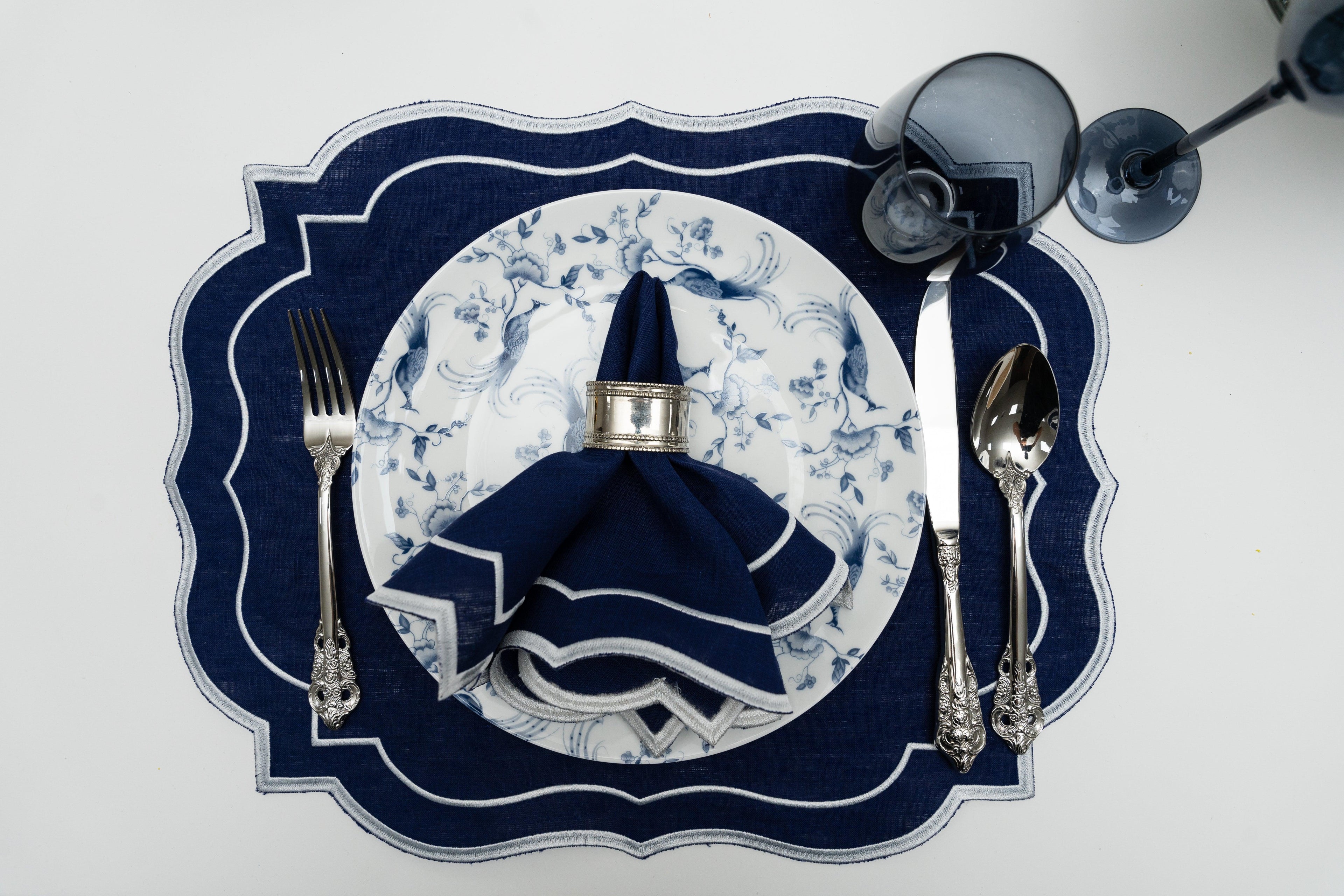 Scalloped Linen Placemats with silverware and napkin on a plate