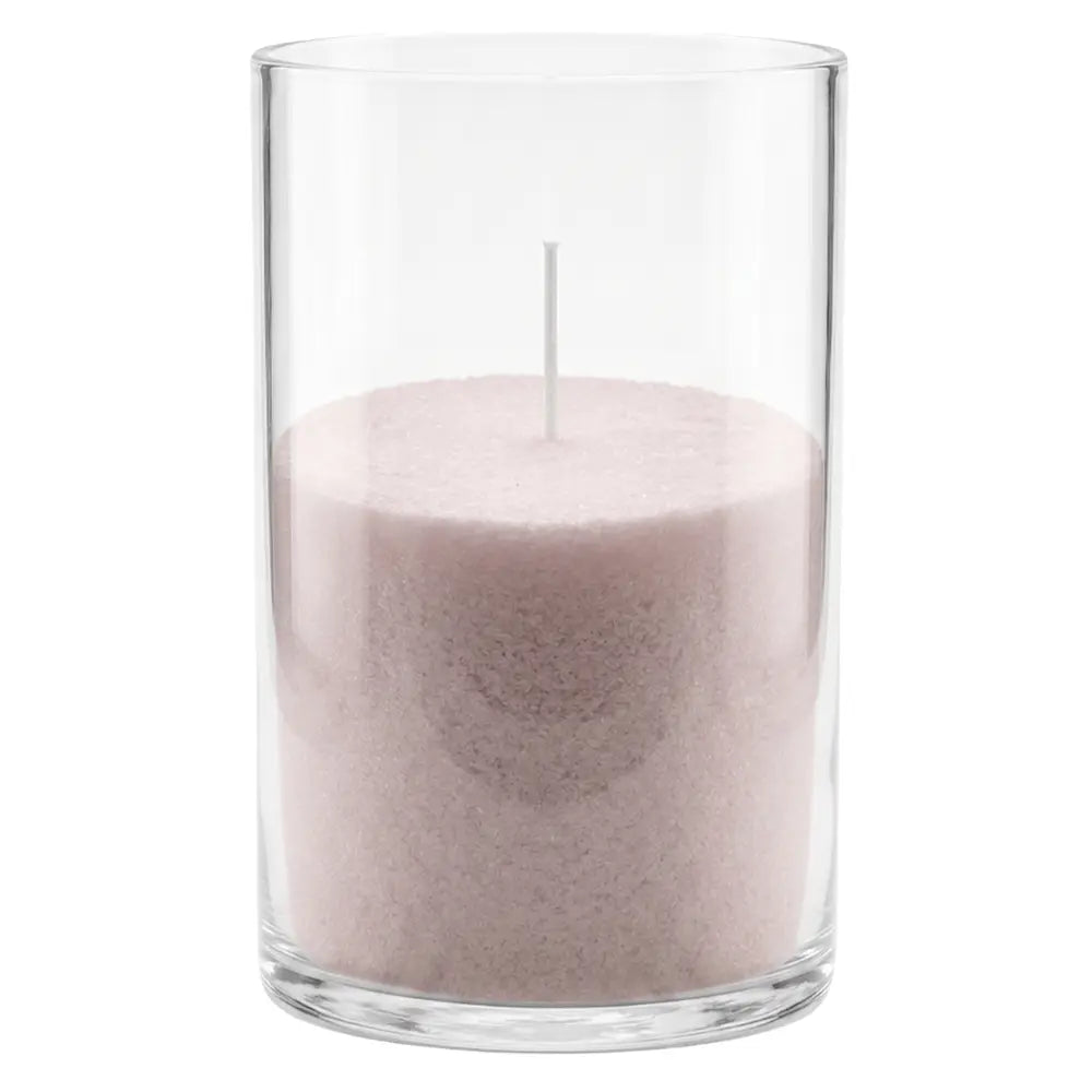 A pink wax candle in a tall, clear glass cylinder container with a single white wick, shown against a plain white background.